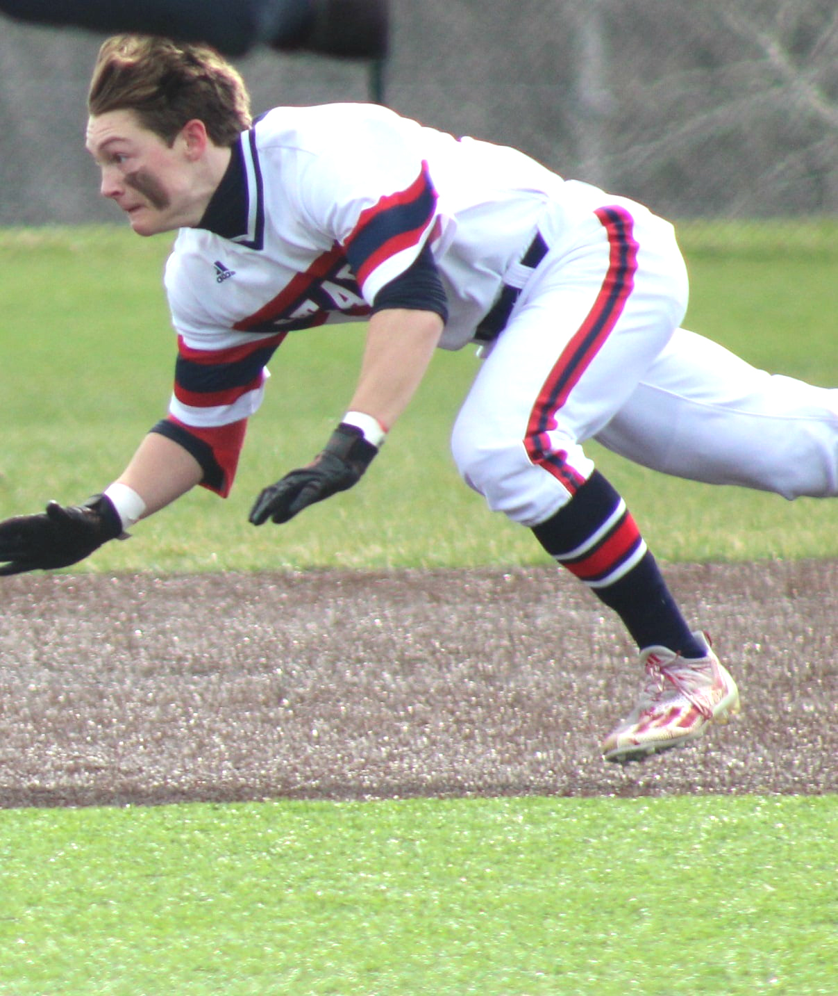 Freshman Cal Gates slides successfully stealing 2nd base. 